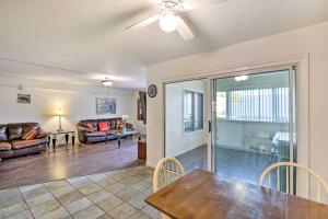 a living room with a table and a couch at Convenient Inglewood Condo 1 Mile to SoFi! in Inglewood