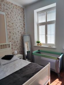 Postel nebo postele na pokoji v ubytování UBYTOVÁNÍ NA SPRÁVNÉM MÍSTĚ
