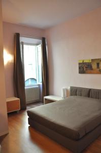 Ένα ή περισσότερα κρεβάτια σε δωμάτιο στο B&B Al Canto del Cavour
