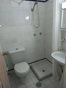 a bathroom with a toilet and a sink at Piso Isla Cristina Punta del Caimán in Isla Cristina