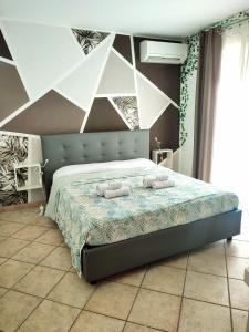 Giường trong phòng chung tại Casa vacanze Isolotto