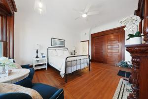 a bedroom with a bed and a living room at Beautiful Condo 2 Bedroom Condo Close to Battery Park Marina - C D in Sandusky