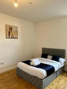 a bedroom with a large bed in a room at Quiet, Private and Serene in Southend-on-Sea