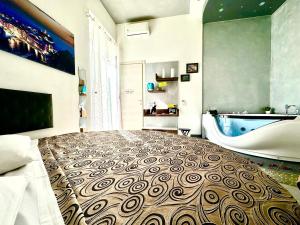 TV a/nebo společenská místnost v ubytování Il Quadrifoglio guesthouse
