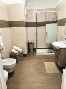 a bathroom with a shower and a toilet and a sink at Alba b&b in Polignano a Mare
