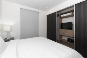 Letto o letti in una camera di Roble Sabana 304 Luxury Apartment - Reserva Conchal