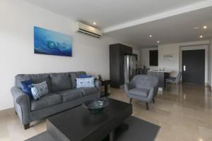 Posezení v ubytování Roble Sabana 304 Luxury Apartment - Reserva Conchal