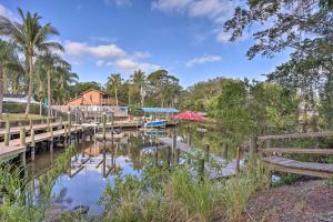 a bridge over a river with boats on it at Stuart Vacation Rental Walk to Private Boat Dock! in Stuart