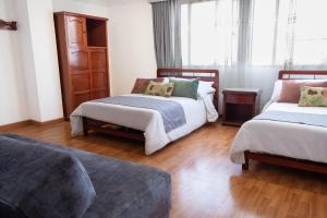 Postel nebo postele na pokoji v ubytování Hotel Virrey Central