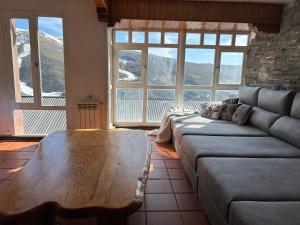a living room with a couch and a coffee table at Arrayanes Royal in Sierra Nevada