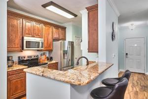 a kitchen with wooden cabinets and a marble counter top at Florida Dream Vacation All new with Amenities in Lutz