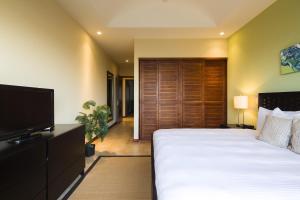 Ένα ή περισσότερα κρεβάτια σε δωμάτιο στο Jobo 7 Luxury Penthouse - Reserva Conchal