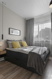Säng eller sängar i ett rum på NN Urban Guesthouse
