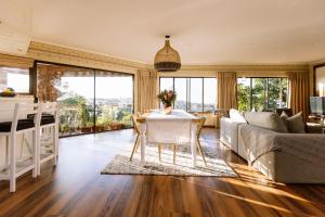 a living room with a table and a couch at Pablo House in Johannesburg