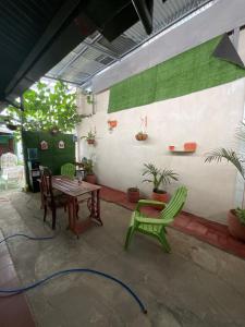 a patio with two chairs and a table and a table and chairs at Hostal Familiar in Granada