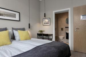 Postel nebo postele na pokoji v ubytování NN Urban Guesthouse