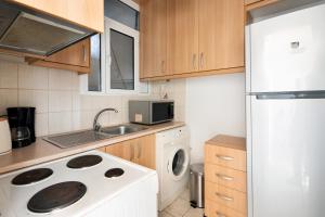 Kitchen o kitchenette sa Elegant flat next to Acropolis - Smiley Property