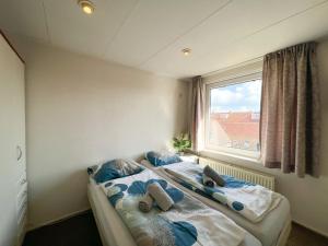 Postel nebo postele na pokoji v ubytování Vakantiewoning aan de Kust 2 - 150 meter van het Egmondse strand!