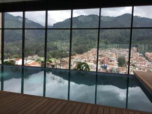 a view of the city from a hotel swimming pool at Enjoy In Bogotá in Bogotá