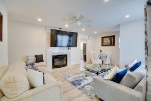 a living room with two couches and a fireplace at Oxon Hill Retreat about 10 Mi to National Mall! in Oxon Hill