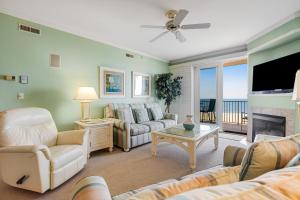a living room with a couch and a fireplace at Adagio 402 in Ocean City
