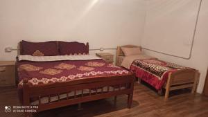 Hotel-Restorant Pepushaj tesisinde bir odada yatak veya yataklar
