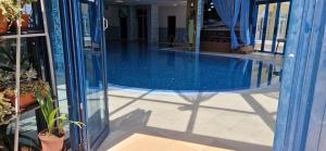 a swimming pool in the middle of a building at Sun Palace Suites in Sunny Beach