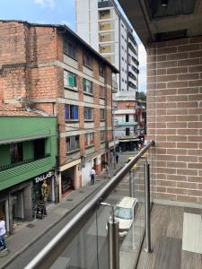 a view of a city street with buildings at Magenta Loft in Medellín