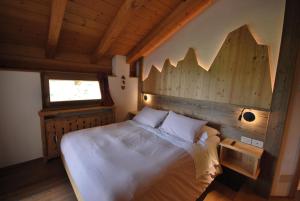 Postel nebo postele na pokoji v ubytování Agriturismo Maso Corradini