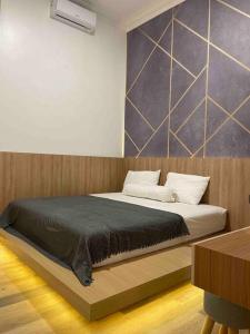Ein Bett oder Betten in einem Zimmer der Unterkunft Dhanis House 7 Bedroom Villa