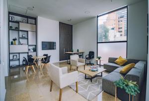 a living room with a couch and a table at Enjoy In Bogotá in Bogotá