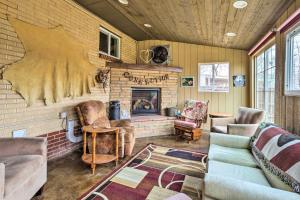 a living room with a couch and a fireplace at Shared Patio and Fire Pit Denver Apartment in Denver