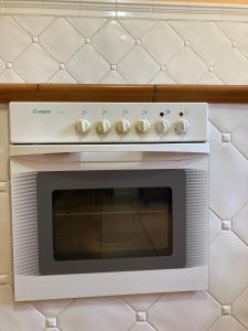 a white stove top oven sitting on a wall at Casa Abedul in Puebla de Lillo +27 photos