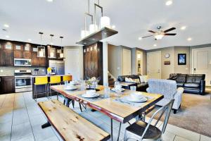 a kitchen and living room with a wooden table and chairs at Entrada at Moab 424 and 428 in Moab