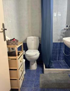 a bathroom with a toilet and a sink at Αγκυροβόλιο in Ilia