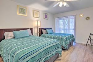 a bedroom with two beds and a ceiling fan at Pet-Friendly Bryan Escape about 2 Mi to Texas AandM in Bryan