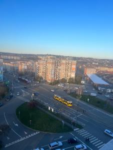 an aerial view of a parking lot with a bus at Panorama 901 in Oradea