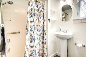 a bathroom with a sink and a shower curtain at Hyannis Getaway about 2 Mi to Beach! in Hyannis