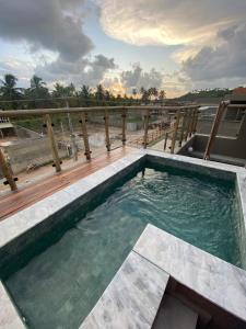 a swimming pool on top of a building at Casa de Dora in São Miguel dos Milagres