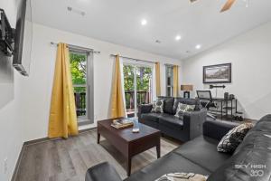 a living room with a couch and a table at Alyce Retreat - Nature, Trails and Lake Escape in Bella Vista