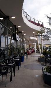 a building with tables and chairs and a balcony at Aires del Cerro in Yerba Buena