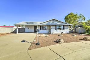 a house with a parking meter in the front yard at Family-Friendly Chandler Home Near Downtown! in Chandler