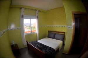 Cama ou camas em um quarto em Coopérative Village Jbel Moussa du Tourisme