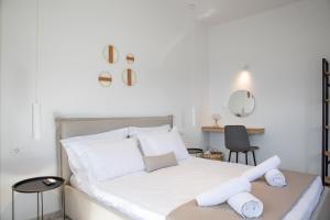 Ένα ή περισσότερα κρεβάτια σε δωμάτιο στο Aegean Eyes 3bd House Βy the Sea