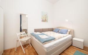 Posteľ alebo postele v izbe v ubytovaní MALIXA - Apartment in the heart of Vienna next to Metro