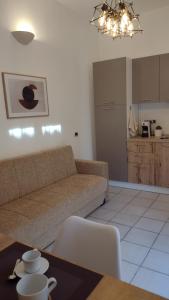 a living room with a couch and a table at LechicchediLampedusa in Lampedusa