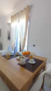 a dining room table with food on it at LechicchediLampedusa in Lampedusa +15 photos