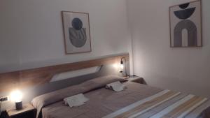 a bedroom with a bed with two pillows on it at LechicchediLampedusa in Lampedusa