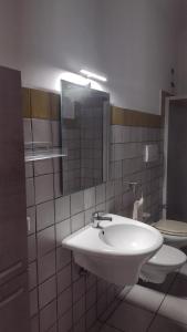 a bathroom with a sink and a toilet at LechicchediLampedusa in Lampedusa