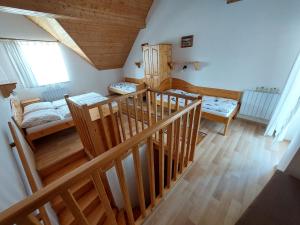 A bed or beds in a room at Apartmán Tatralandia 336 Még 37 kép